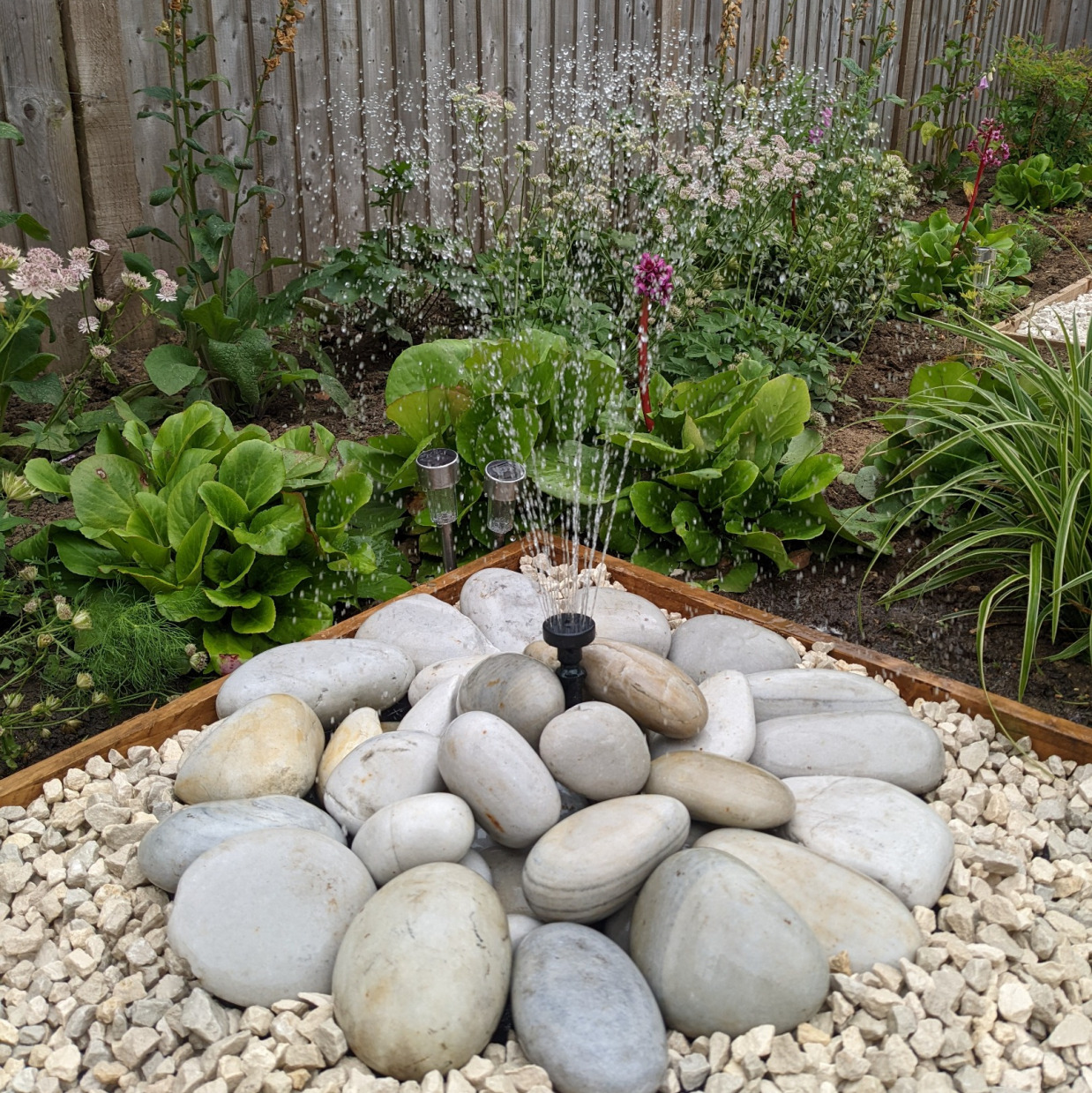 Water feature pebble pond fountain